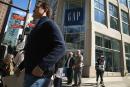 Shoppers walk past a GAP store along the Magnificent Mile shopping district on September 13, 2024 in Chicago, Illinois. 