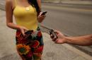 Cubans exchange contact information with their mobile phones in the Vedado neighborhood of Havana January 20, 2024 in Havana, Cuba.