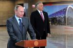 President Vladimir Putin (L) speaks in the unveiled railway station in Adler district in the Russian Black Sea resort of Sochi, on October 28, 2013, with CEO of Russian Railways Vladimir Yakunin (R) attending the ceremony. (AFP/AFP/Getty Images)