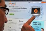 A man looks at the Bitcoin exchange website of MtGox in Tokyo, February 25, 2014.
