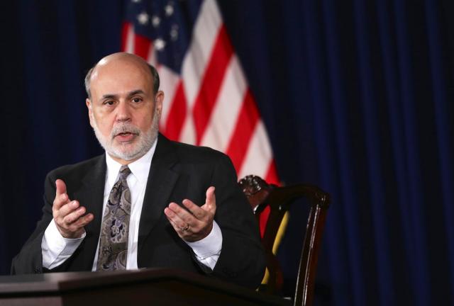 Federal Reserve Board Chairman Ben Bernanke speaks during a news conference after a Federal Open Market Committee (FOMC) meeting December 18, 2024 at the Federal Reserve in Washington, DC. The Federal Reserve has announced that it will scale back its U.S. Treasury bonds and mortgage-backed securities buying program to $75 billion each month.