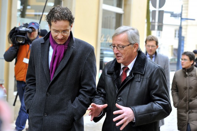 Jeroen Dijsselbloem (L) and Jean-Claude Juncker, present and past presidents of the Eurogroup