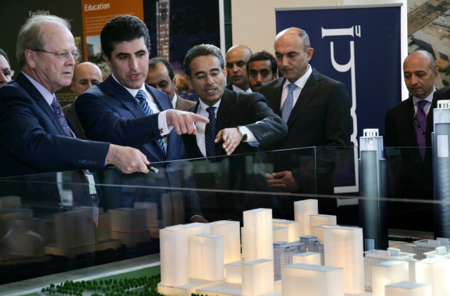 Chairman of Dubai's Emaar Properties Mohamed Alabbar (C) and Prime Minister of the Kurdistan Regional Government, Nechirvan Barzani (2ndL) look at the architecural model of the "Downtown Erbil" project during its presentation on October 27, 2024 in Arbil. Photo: AFP/Getty Images