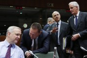 (L-R) European Union Economic and Monetary Affairs Commissioner Olli Rehn, Greece's Finance Minister Yannis Stournaras, France's Finance Minister Pierre Moscovici and European Commissioner for Internal Market and Services Michel Barnier attend a European Union finance ministers meeting in Brussels December 10, 2013.