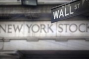 A Wall Street sign outside the New York Stock Exchange.