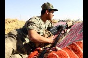 A fighter from the Fajr Libya (Libya Dawn) militia ear the Wetia military air base, west of the capital Tripoli, February 4, 2015. MAHMUD TURKIA/AFP/Getty Images