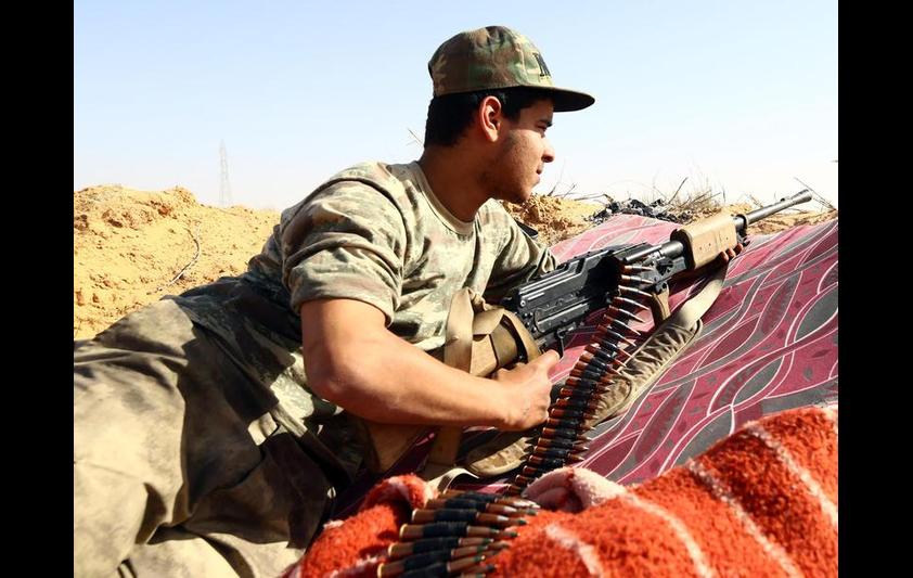 A fighter from the Fajr Libya (Libya Dawn) militia ear the Wetia military air base, west of the capital Tripoli, February 4, 2015. MAHMUD TURKIA/AFP/Getty Images