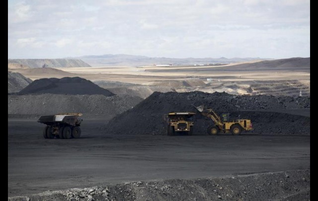 Coal is loaded onto dump trucks in Tsogttsetsii, Omnugovi province, Mongolia, on Thursday, June 19, 2014. Bloomberg/Bloomberg via Getty Images