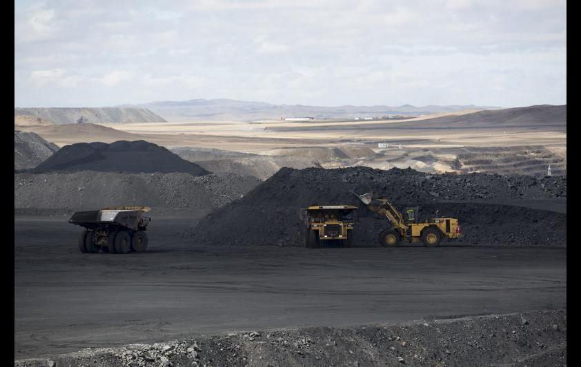 Coal is loaded onto dump trucks in Tsogttsetsii, Omnugovi province, Mongolia, on Thursday, June 19, 2014.  Bloomberg/Bloomberg via Getty Images