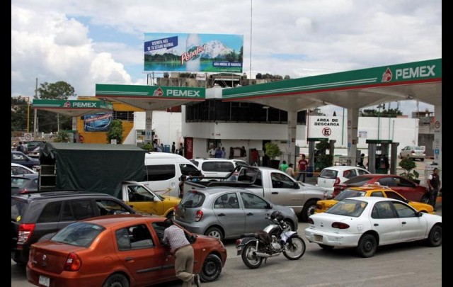 Vehicles queue at a gas station in Oaxaca, Mexico, on June 5, 2015, since there is shortage of petrol due to blockades outside gas tanks. PATRICIA CASTELLANOS/AFP/Getty Images