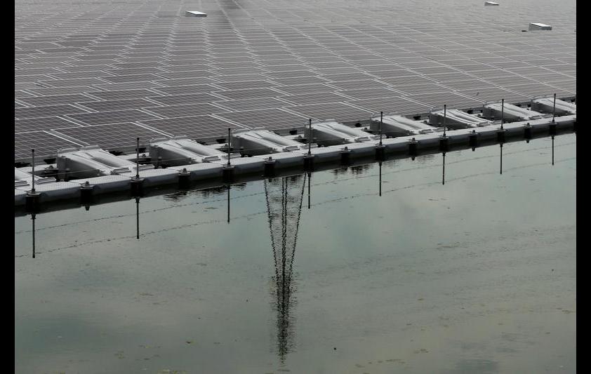 Solar panels sit in an array at the 2.3-megawatt floating solar power station operated by Kyocera TCL Solar LLC, a joint venture between Kyocera Corp. and Century Tokyo Leasing Corp., on Sakasamaike Pond in Kasai, Hyogo Prefecture, Japan, on Sunday, May 24, 2015. Bloomberg/Bloomberg via Getty Images