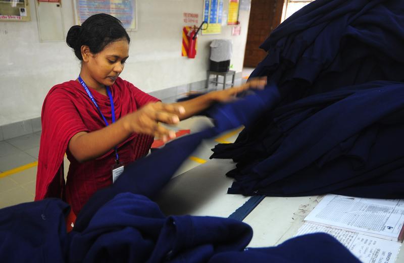 A Bangladeshi woman works in a garments factory in Ashulia on June 23, 2010. AFP PHOTO/MUNIR UZ ZAMAN