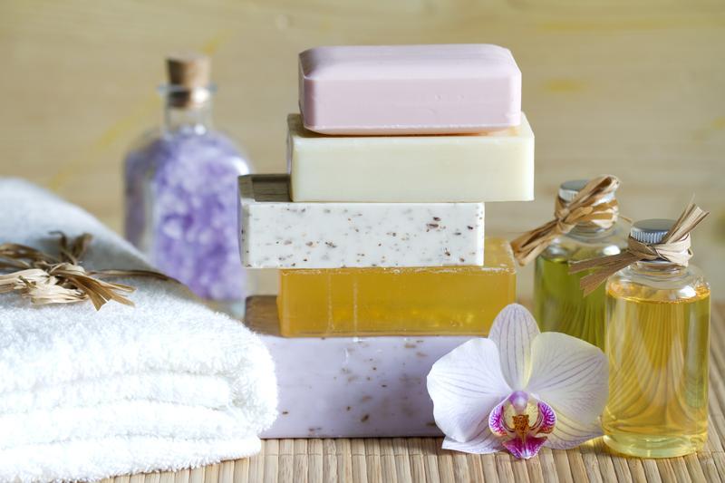 Assorted bars of soap, some with microbeads,  along with other spa cosmetics. Getty Images