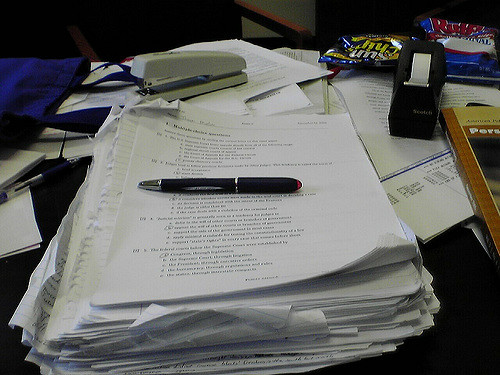 Papers to be graded. (Source: Chris Lawrence/flickr)