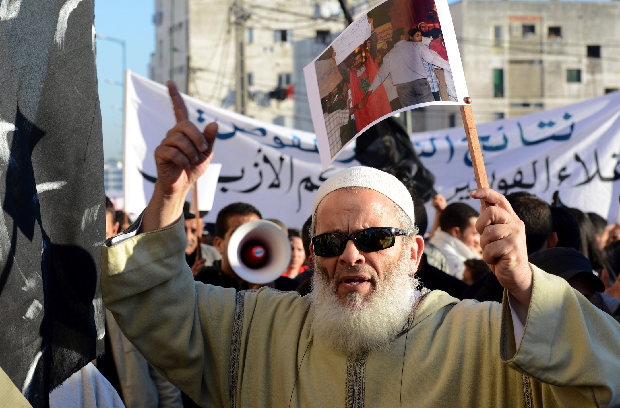 A member of Morocco's "February 20" movement shouts slogans during a protest to demand the release of all political prisoners in Rabat on December 23, 2012. AFP PHOTO/FADEL SENNA