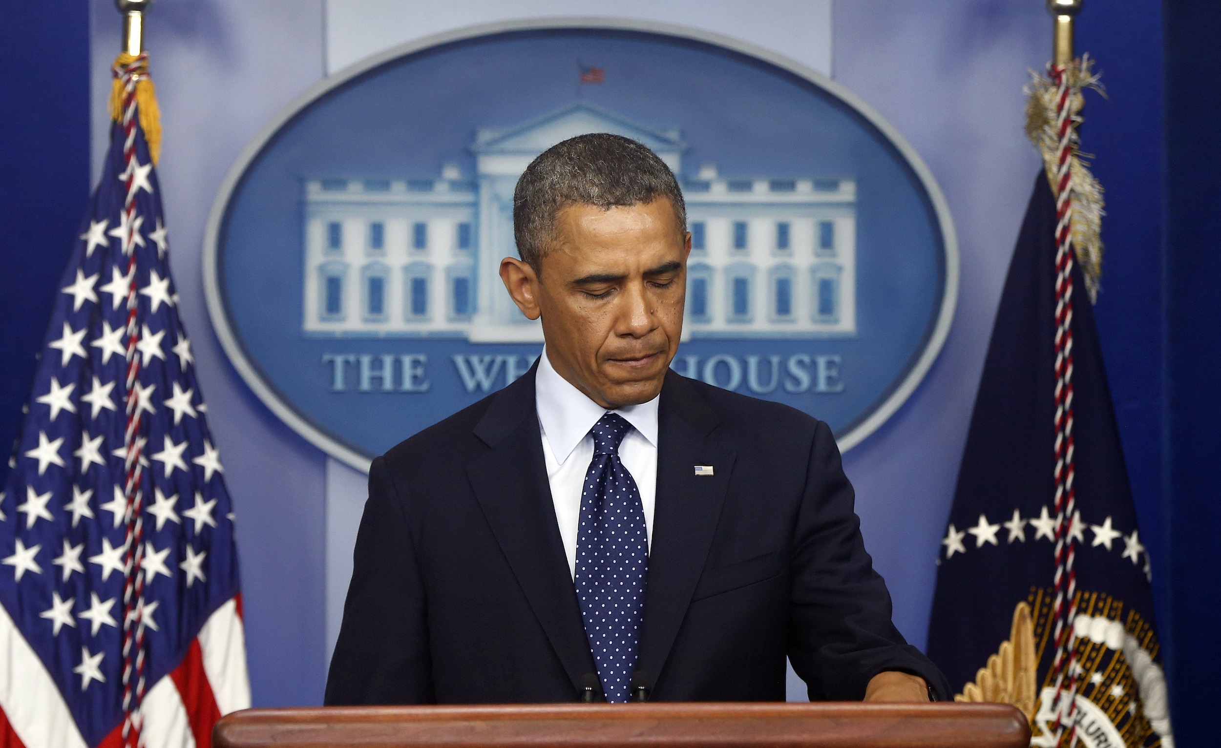 President Barack Obama pauses as he begins to speak in the James Brady Press Briefing Room at the White House in Washington, Monday, April 15, 2013, following the explosions at the Boston Marathon. (AP Photo/Charles Dharapak)