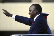 Kenya's Uhuru Kenyatta waves during his inauguration.