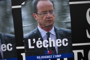 New campaign posters of the French right wing opposition party UMP showing French President Francois Hollande and reading "L'Echec" ("The failure") are pictured in a street of Paris in May 6, 2013.