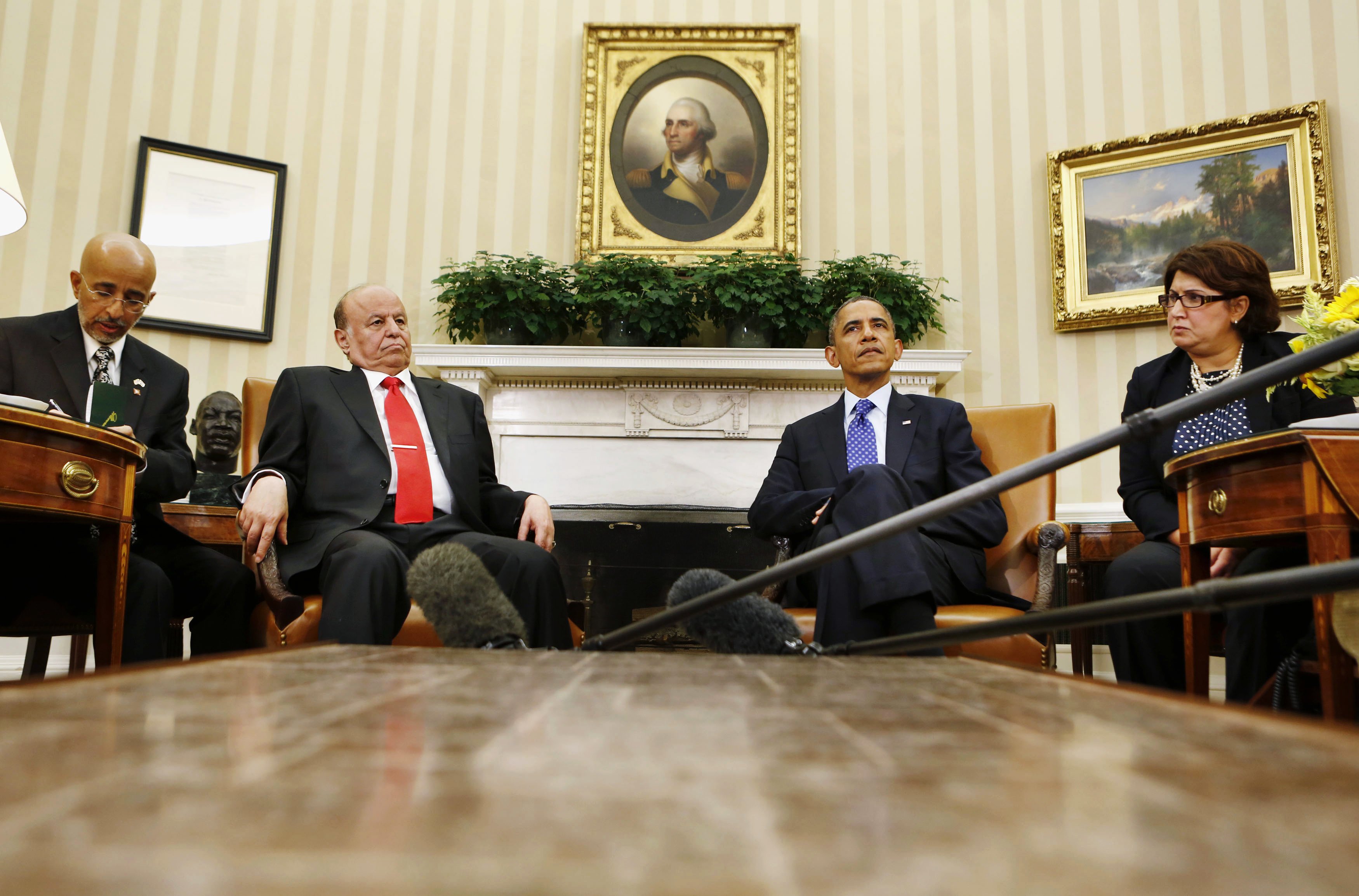 U.S. President Barack Obama (2nd R) and his Yemeni counterpart Abd Rabbuh Mansur Hadi (2nd L) sit next to their translators during a meeting in the Oval Office at the White House in Washington, August 1, 2013. REUTERS/Larry Downing