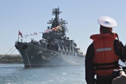 REFILE - ADDITIONAL INFORMATION A sailor looks at the Russian missile cruiser Moskva moored in the Ukrainian Black Sea port of Sevastopol in this May 10, 2024 file photo. REUTERS/Stringer