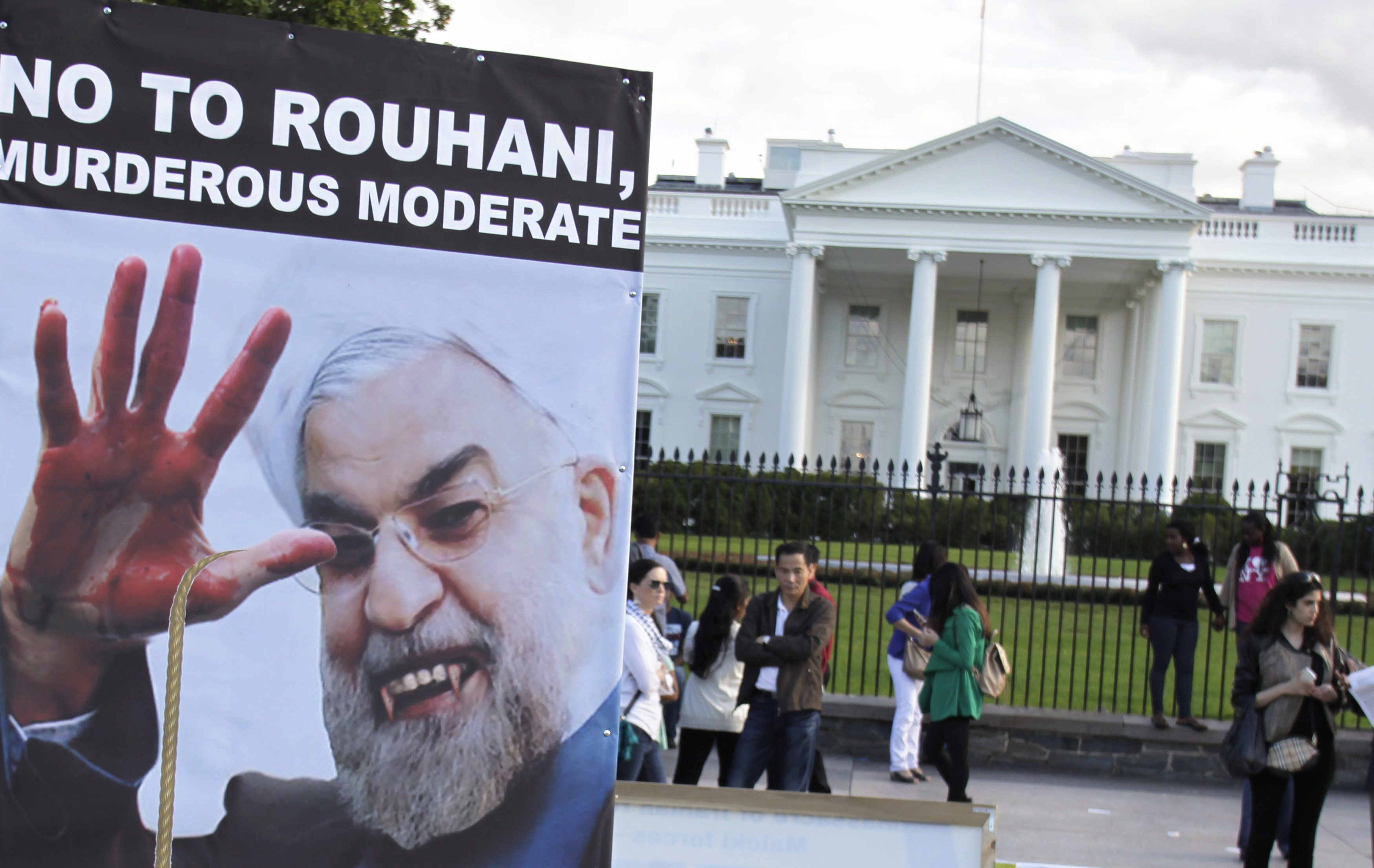 Iranian Americans protest against a conversation between U.S. President Barack Obama and new Iranian President Hassan Rouhani, outside the White House in Washington September 28, 2013. REUTERS/Yuri Gripas
