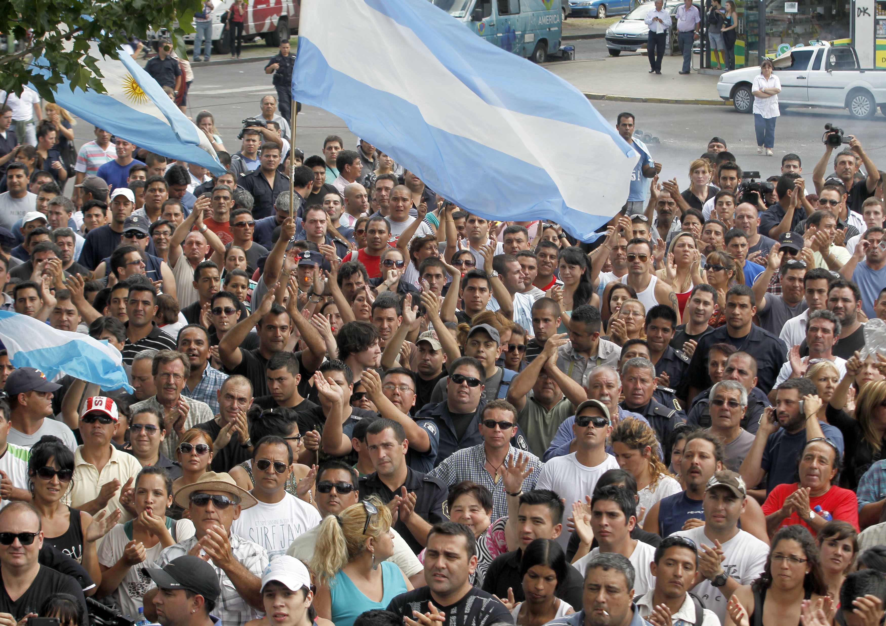 Policemen and their relatives from La Plata, the capital of Buenos Aires province gather during a protest in downtown La Plata December 9, 2013. Police in several Argentine provinces are demanding better wages and working conditions, local media reported.