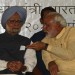 Indian Prime Minister Manmohan Singh (L) and Gujarat state Chief Minister Narendra Modi speak onstage in Ahmedabad. (SAM PANTHAKY/AFP/Getty Images)