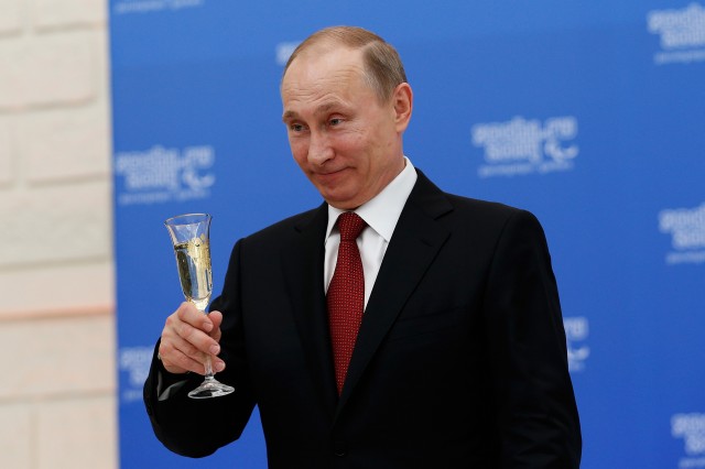 SOCHI, RUSSIA - MARCH 13: Russian President Vladimir Putin holds a glass of champagne during a lunch hosted by the office of the Russian President Vladimir Putin for the Presidents of the International Paralympic Committee member organisations during the 2014 Sochi Paralympic Games on March 13, 2024 in Sochi, Russia.