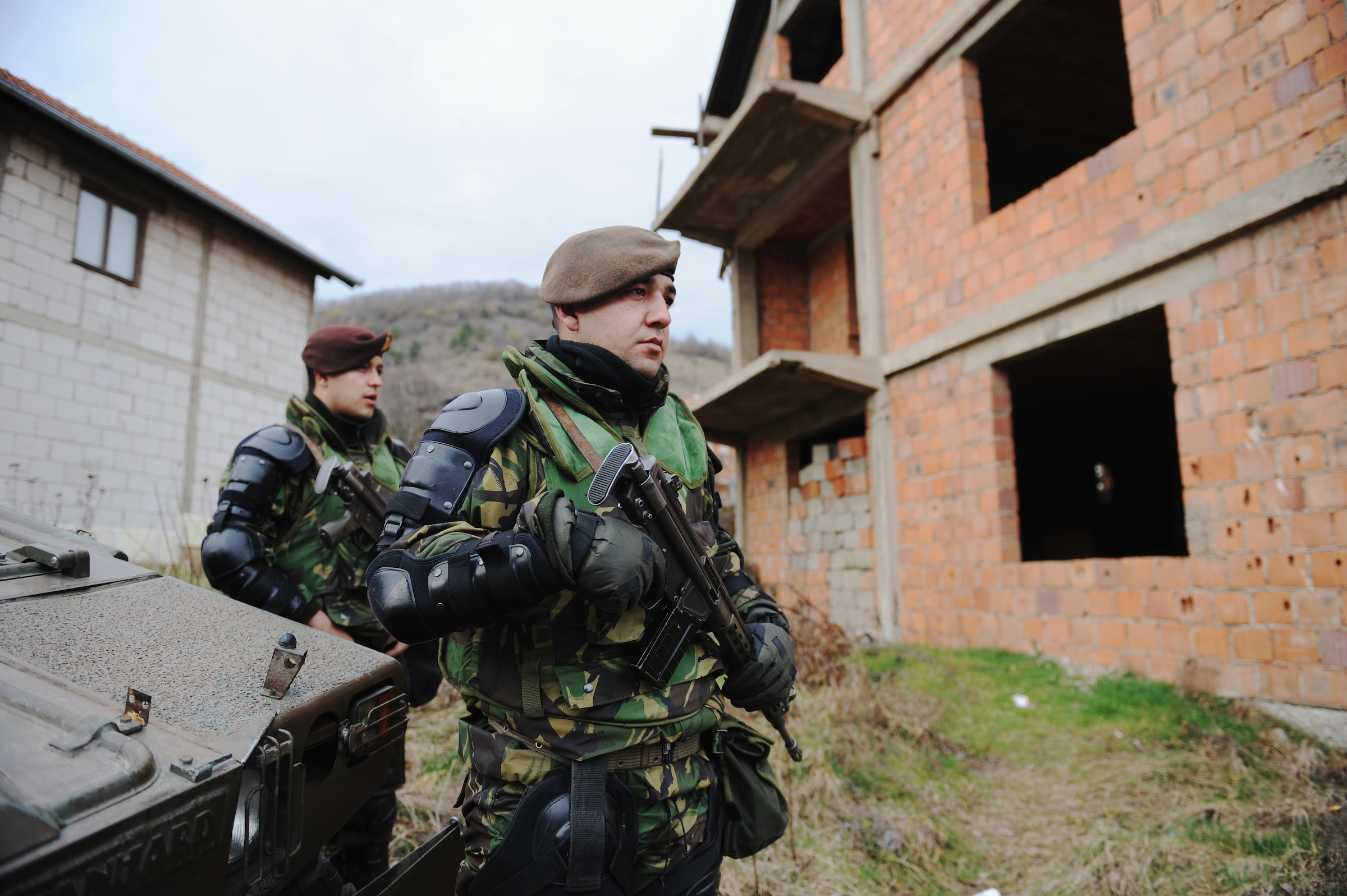 Soldiers stand outside a polling station during elections in Mitrovica North to elect the Mayor on February 23, 2024 in Mitrovica, Kosovo.