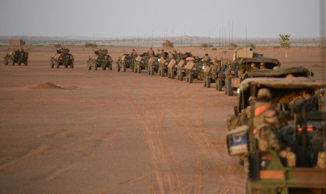 A French army convoy leaves camp at sunrise on November 2, 2013, during Operation Hydra near Gao in northern Mali. AFP PHOTO/PHILIPPE DESMAZES