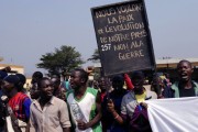 Protesters hold a sign: “We want peace and the development of our country, we refuse war” in Bangui. AFP/ SIA KAMBOU