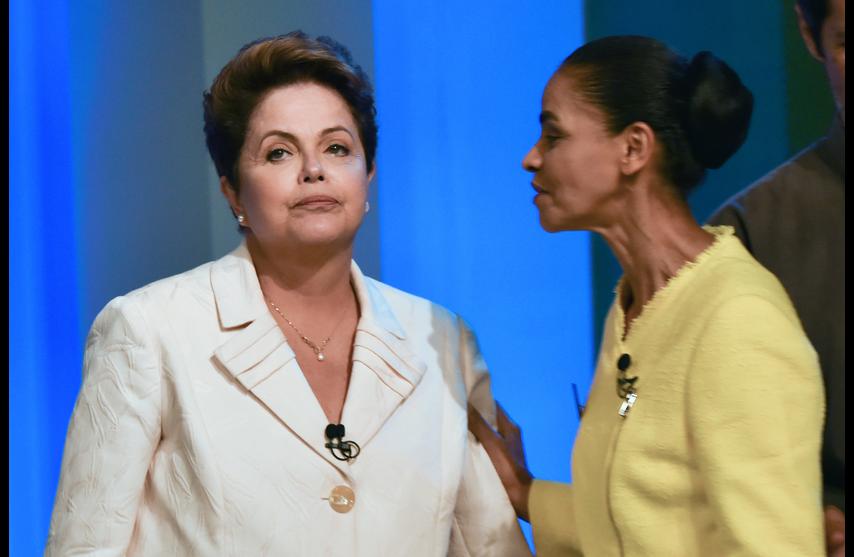 Brazilian President and candidate to reelection of the Workers Party (PT) Dilma Rousseff (L) and Marina Silva, candidate of the Brazilian Socialist Party (PSB), are seen before their last TV debate in Rio de Janeiro, Brazil, on October 2, 2014. Brazil's general election will be held on October 5, 2014. AFP PHOTO / YASUYOSHI CHIBA