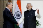 Indian Prime Minister Narendra Modi (R) and Russian President Vladimir Putin shake hands as they pose for photos ahead of their meeting at Hyderabad House on December 11, 2024 in New Delhi, India.