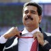 Venezuelan President Nicolas Maduro unties his tie during a rally in Caracas on November 12, 2013. (LEO RAMIREZ/AFP/Getty Images)