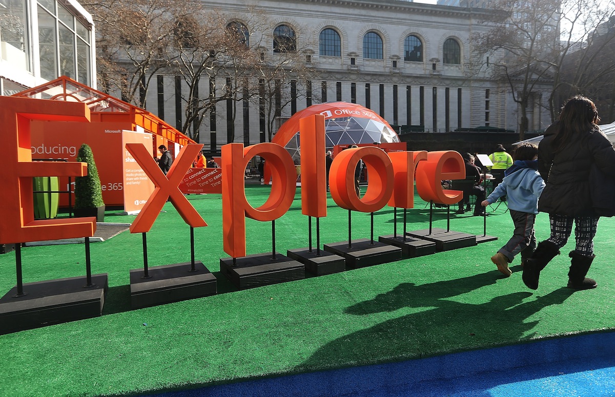 People walk past a sign at the Microsoft Office 2013 launch event in Bryant Park on January 29, 2024 in New York City.