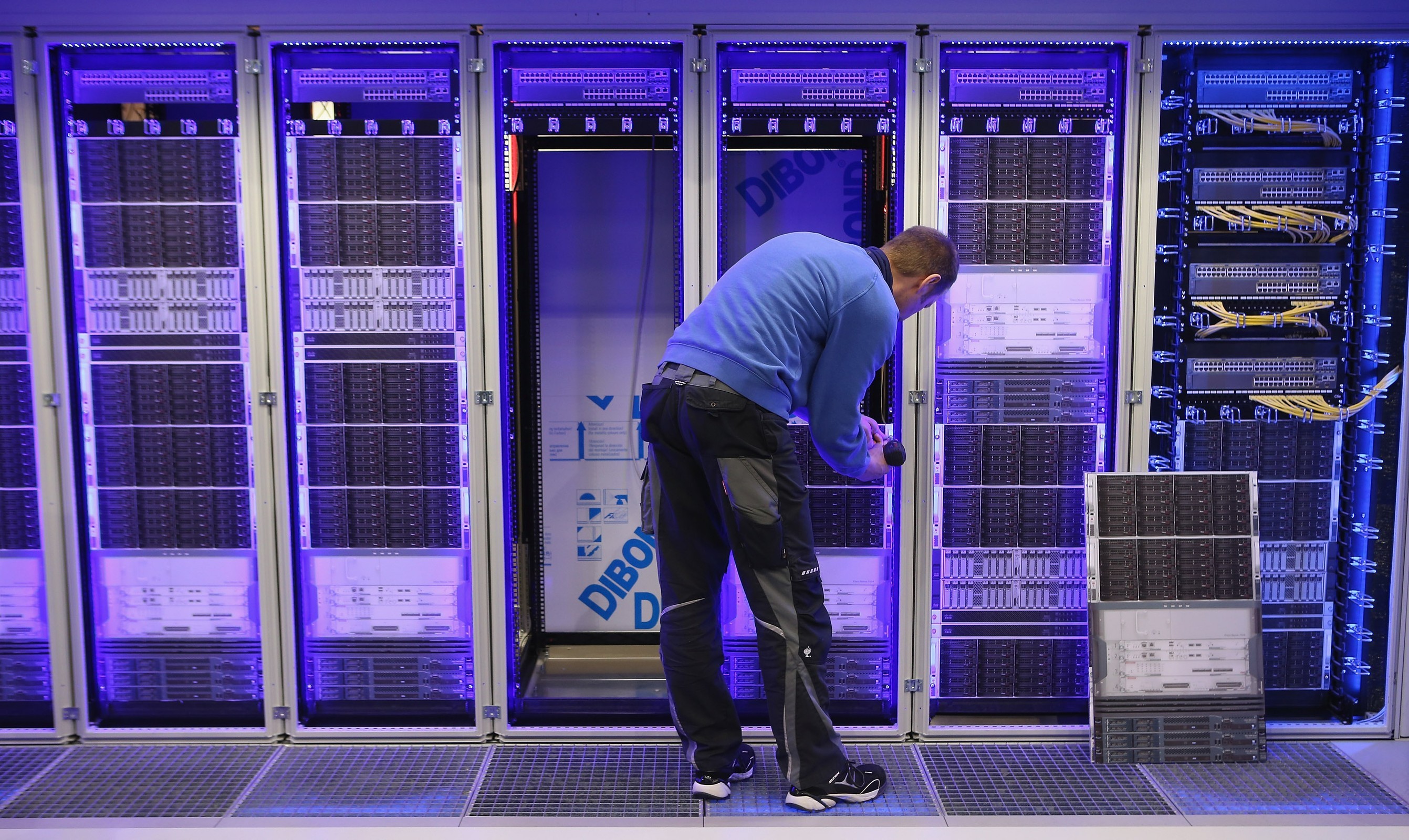 A worker assembles a data center module container at the Rittal stand at the 2013 CeBIT technology trade fair the day before the fair opens to visitors on March 4, 2024 in Hanover, Germany. CeBIT will be open March 5-9.