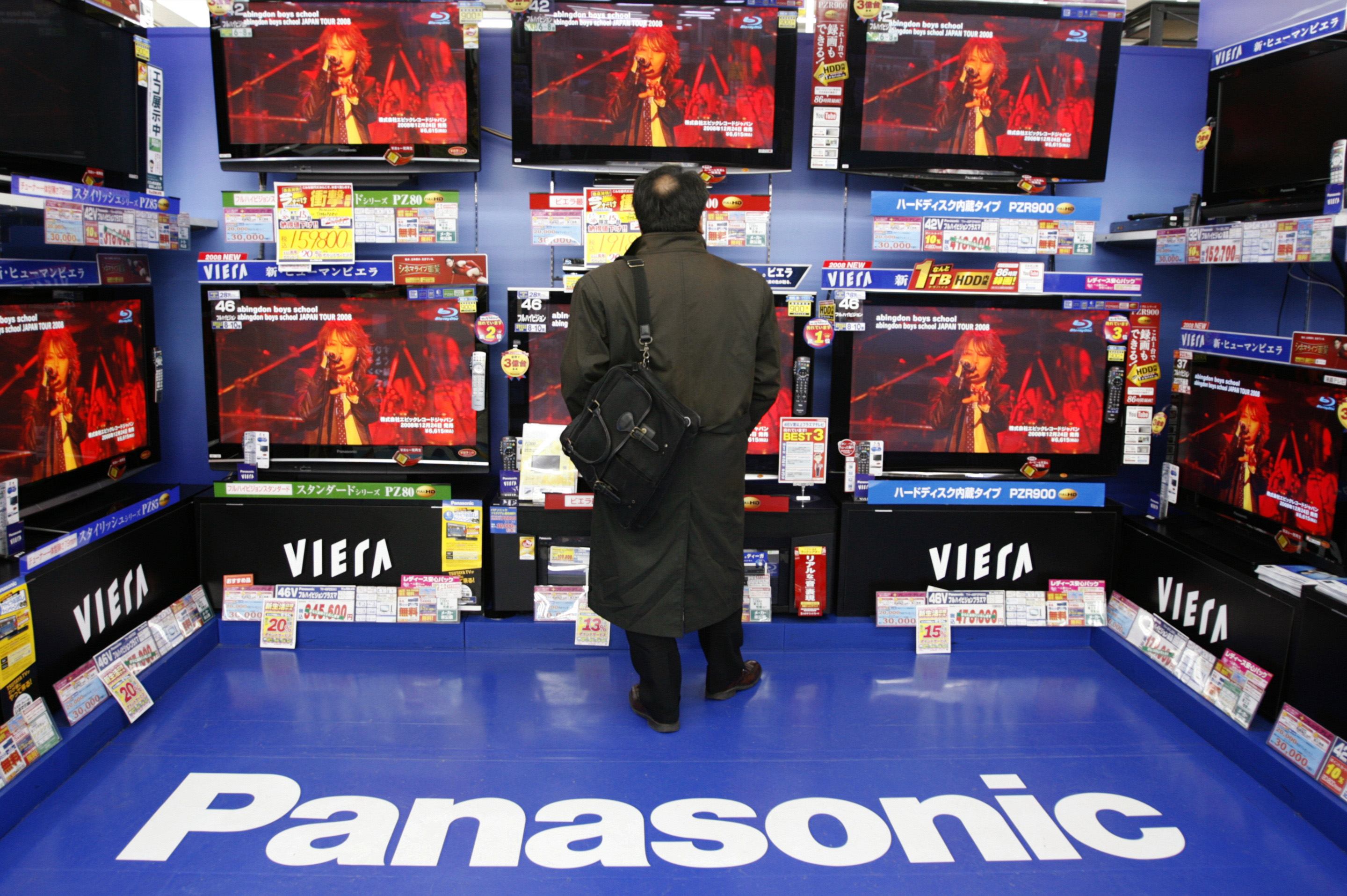 A man looks at Panasonic televisions displayed at an electronic shop in Tokyo. Reuters/ Yuriko Nakao