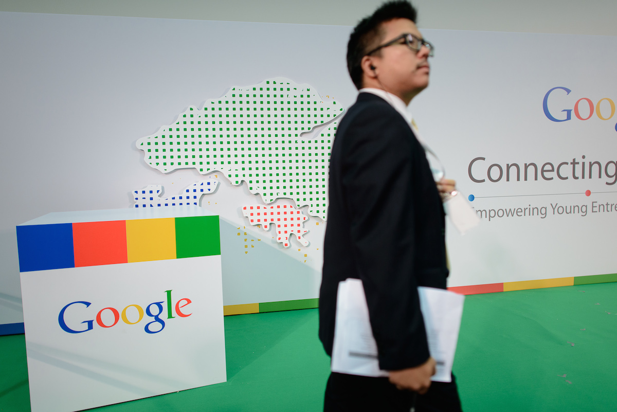 A man stands by a Google logo before Google's Eric Schmidt addresses the Chinese University in Hong Kong on November 4, 2013. PHILIPPE LOPEZ/AFP/Getty Images