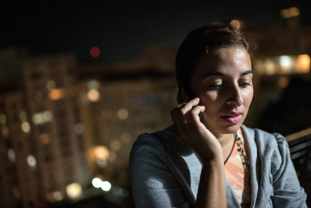 Vanice Luna speaks on her cell phone in Rio de Janeiro, Brazil. YASUYOSHI CHIBA/AFP/Getty Images