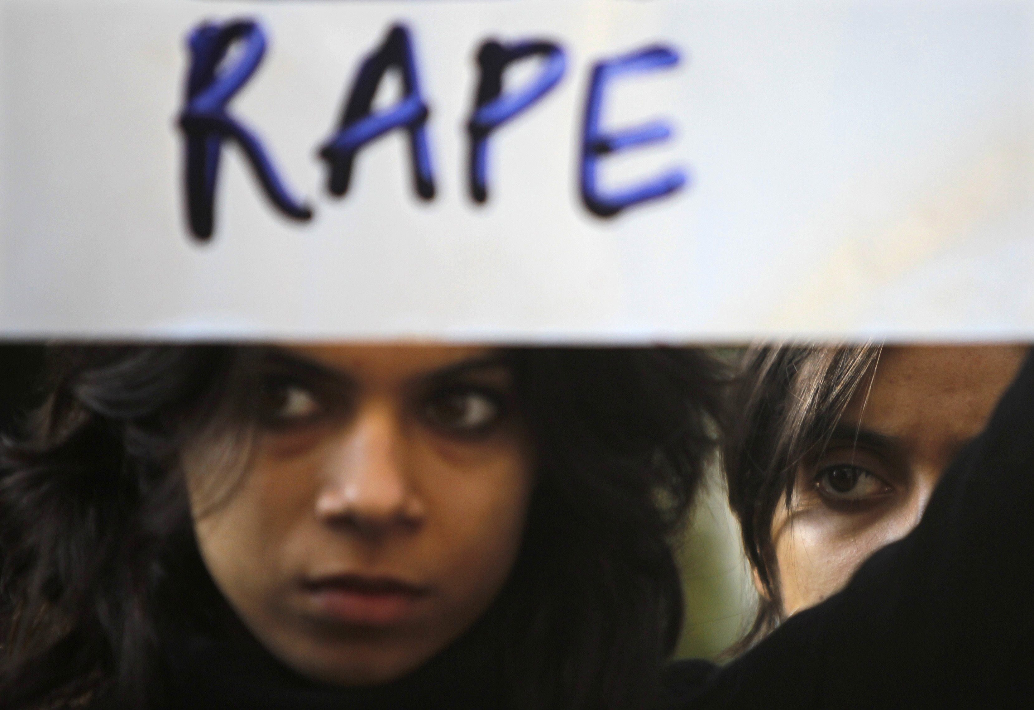 A protester holds a placard during a rally demanding the state government to ensure the safety of women in the capital city, outside the residence of Delhi's Chief Minister Sheila Dixit in New Delhi December 19, 2012. REUTERS/Mansi Thapliyal
