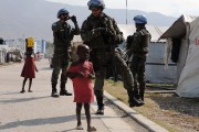 Brazilian soldiers (Brazil leads a mission of UN peacekeepers here) patrol a camp for survivors of the January 2010 quake in Haiti which killed 250,000 people, on February 28, 2024 in Port-au-Prince. AFP PHOTO/VANDERLEI ALMEIDA