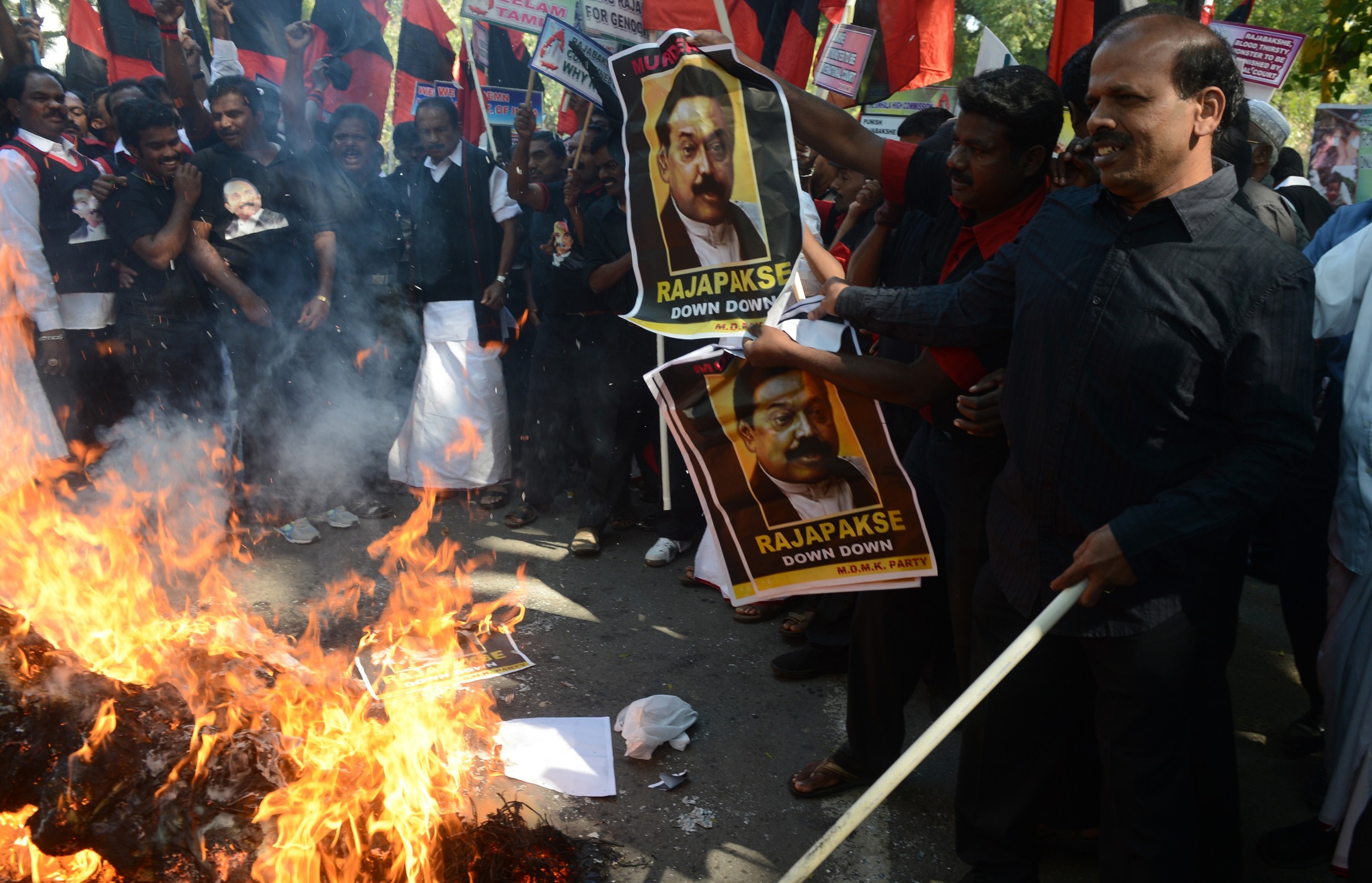 Indian activists burn an effigy of Sri Lankan President Mahinda Rajapakse during a protest in New Delhi on February 8, 2013. (RAVEENDRAN/AFP/Getty Images)