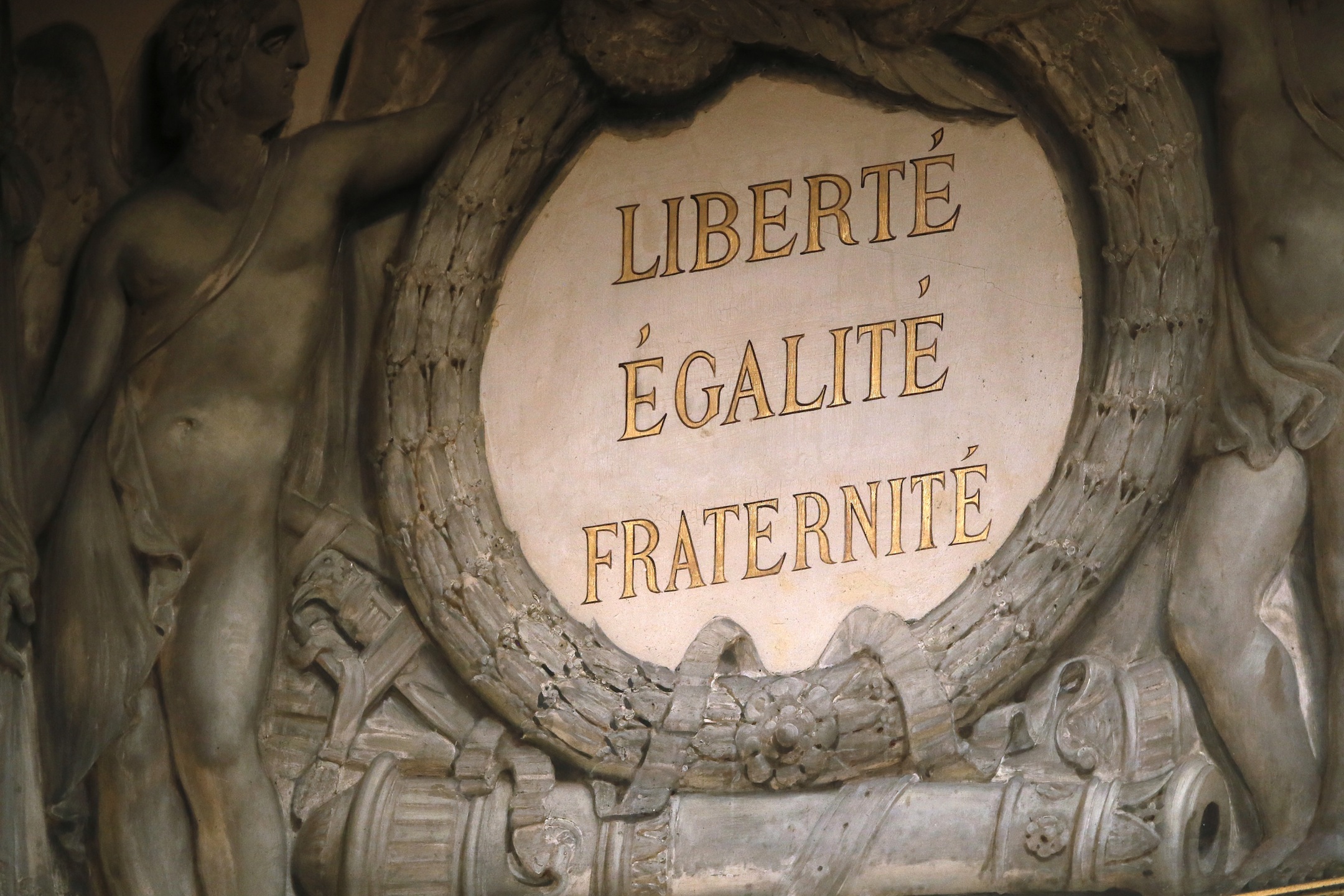 A view of a sculpture surrounding a plaque inside the French National Assembly with the national moto of France "Liberty, Equality, Fraternity" on May 15, 2013, in Paris. AFP PHOTO / PATRICK KOVARIK