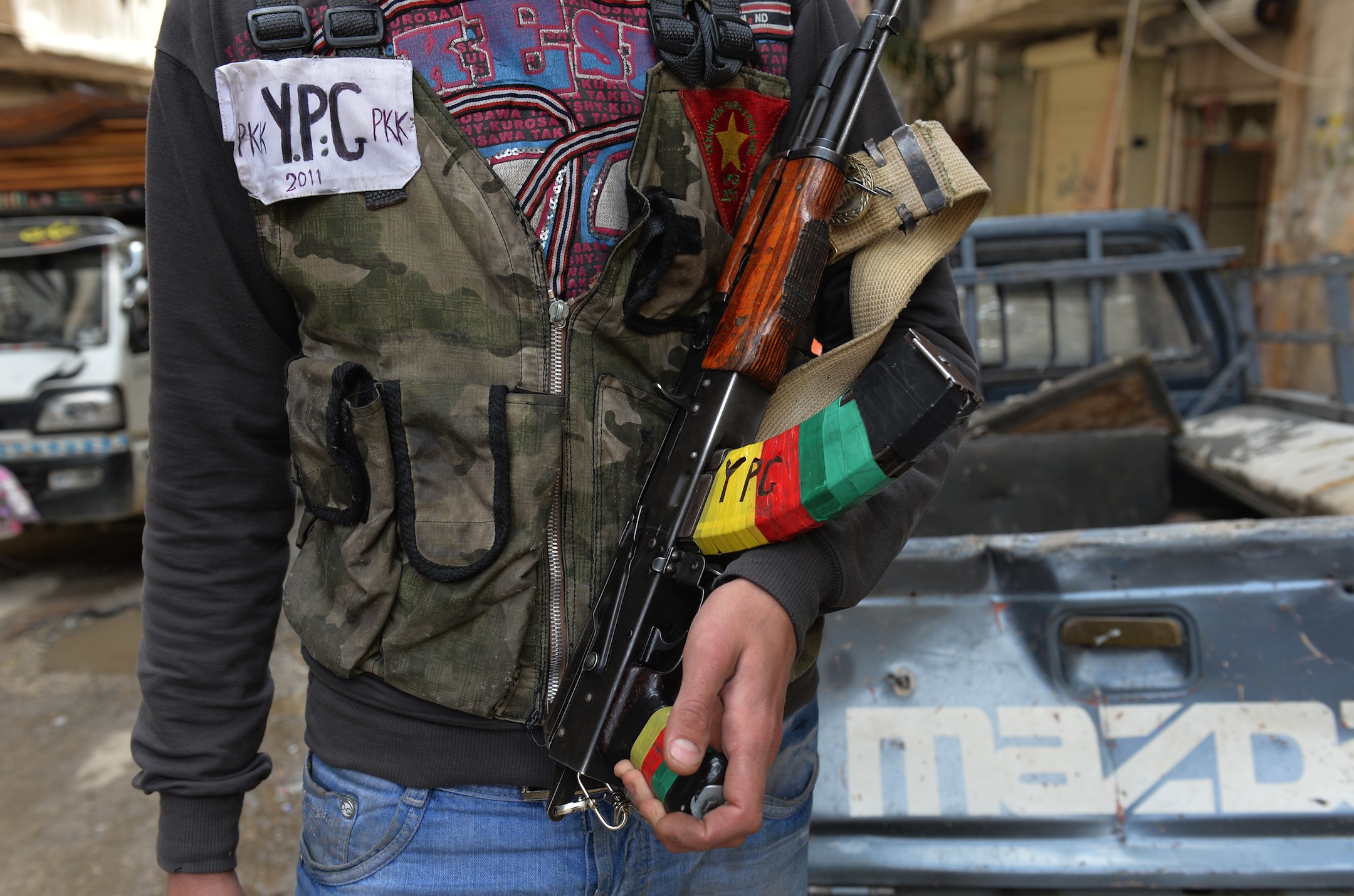 A Kurdish fighter from the "Popular Protection Units" (YPG) is pictured in the majority-Kurdish Sheikh Maqsud district of the northern Syrian city of Aleppo, on April 21, 2013.