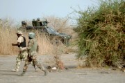 Nigerian soldiers patrol in the north of Borno state close to a former Boko Haram camp on June 5, 2024 near Maiduguri. ( AFP PHOTO / Quentin Leboucher)