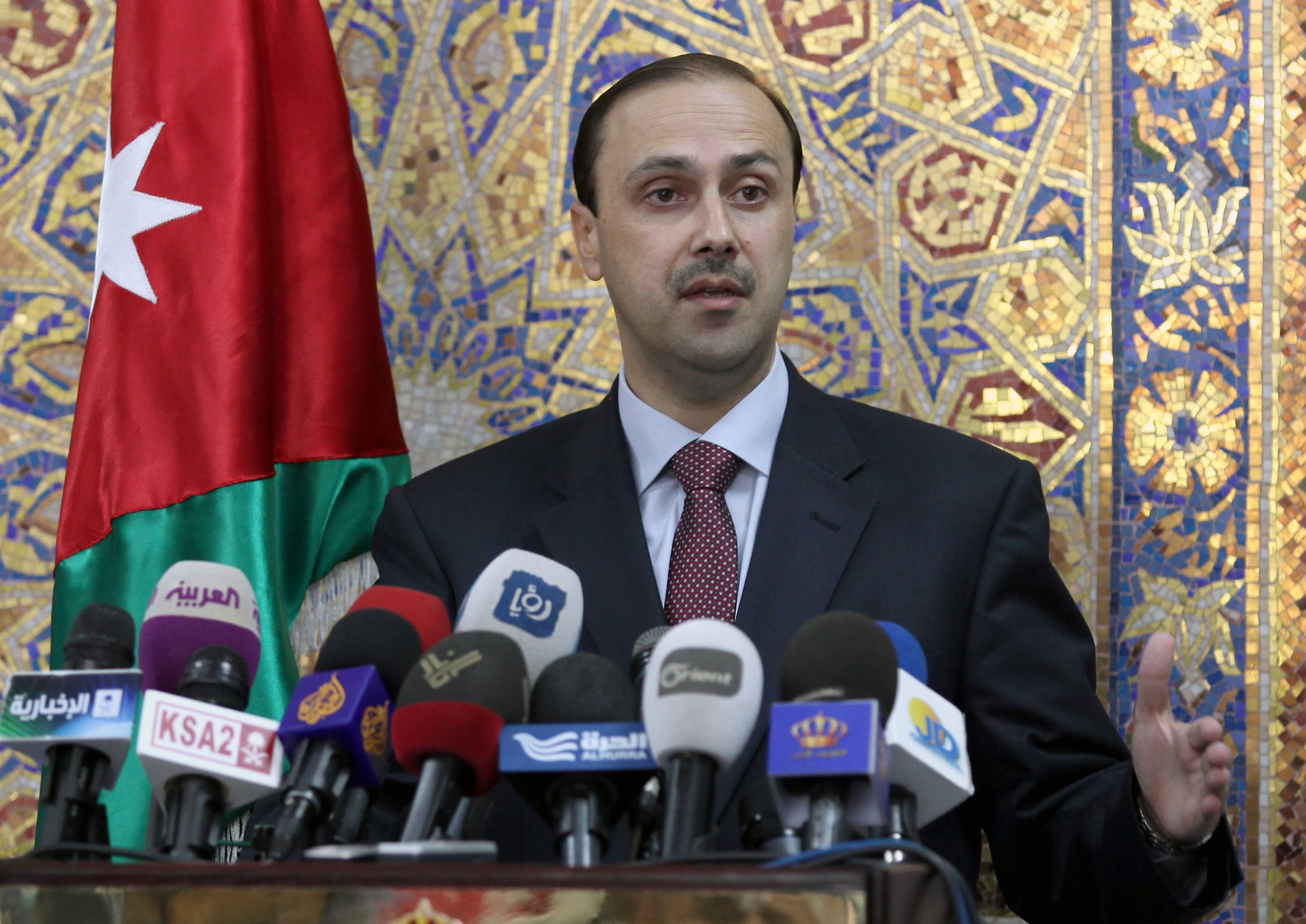 Jordan's Information Minister Mohammad Momani speaks during a press conference in Amman on May 15, 2013. (AFP PHOTO)