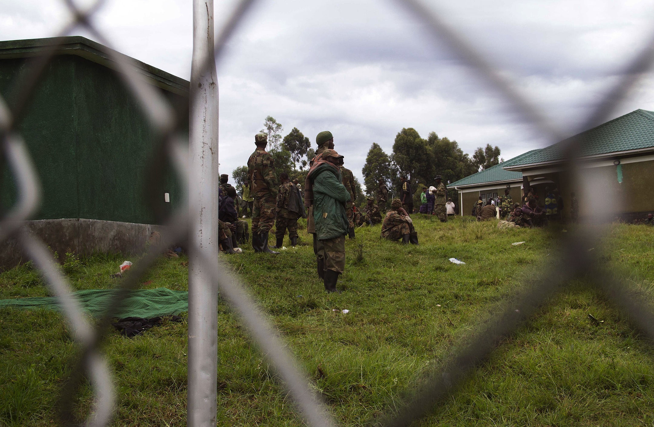 Some of the Democratic Republic of Congo's M23 rebels who surrendered to the Ugandan army stand in an isolated location in the village of Rugwerero in the Kisoro district, about 500 kms west of Kampala, on November 8, 2013.