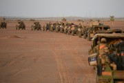 A French army convoy leaves camp at sunrise on November 2, 2013, during Operation Hydra near Gao in northern Mali.