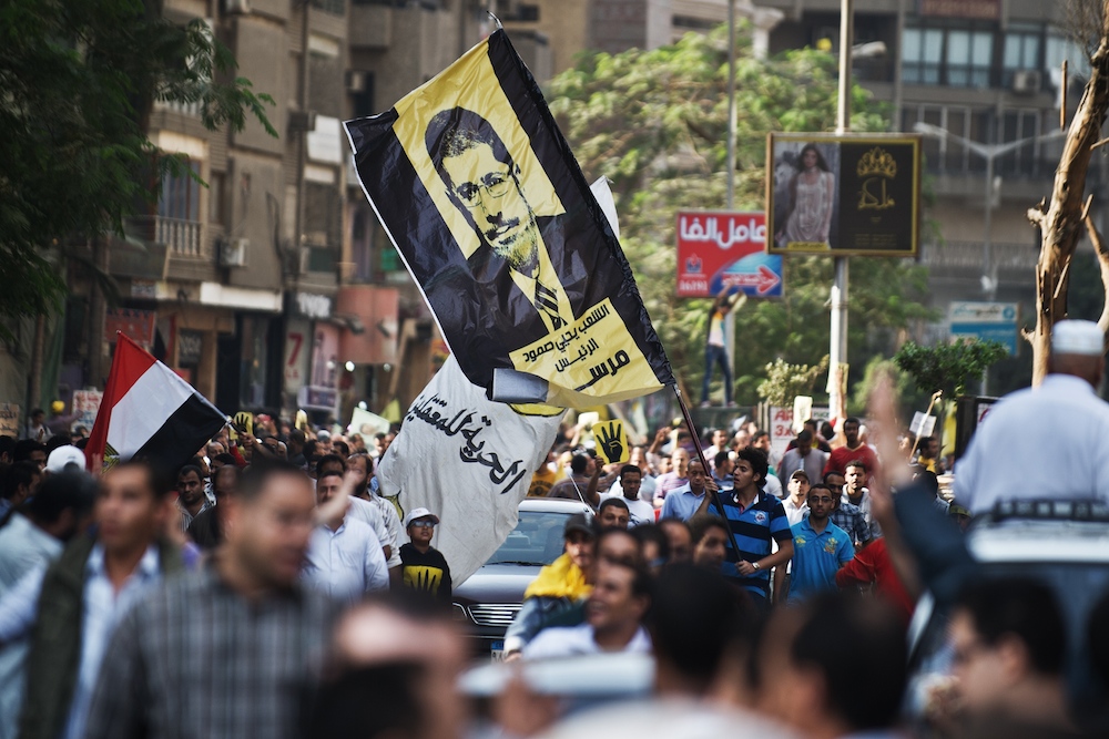 Supporters of the Muslim Brotherhood in a march in Cairo, November 8, 2013. (AFP PHOTO/GIANLUIGI GUERCIA)