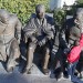 An assistant touches up a new statue depicting Roosevelt, Churchill and Stalin at the Yalta Conference during WWII. (Yuri Lashov/AFP/Getty)
